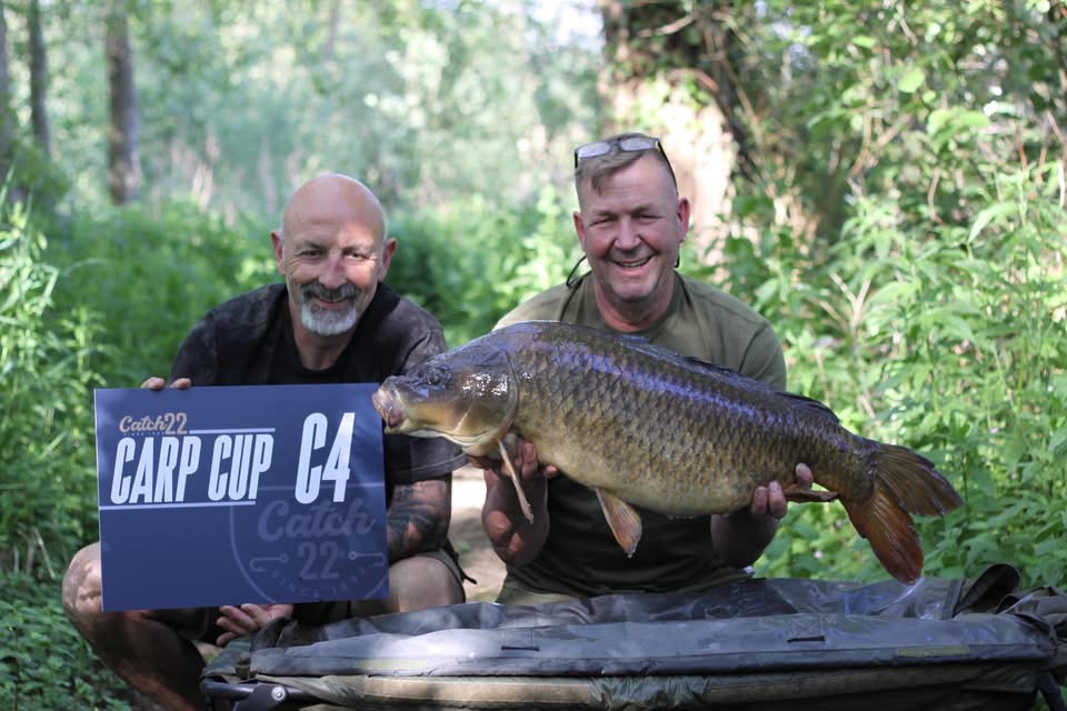 Two anglers with a carp caught during the Catch 22 Carp Cup